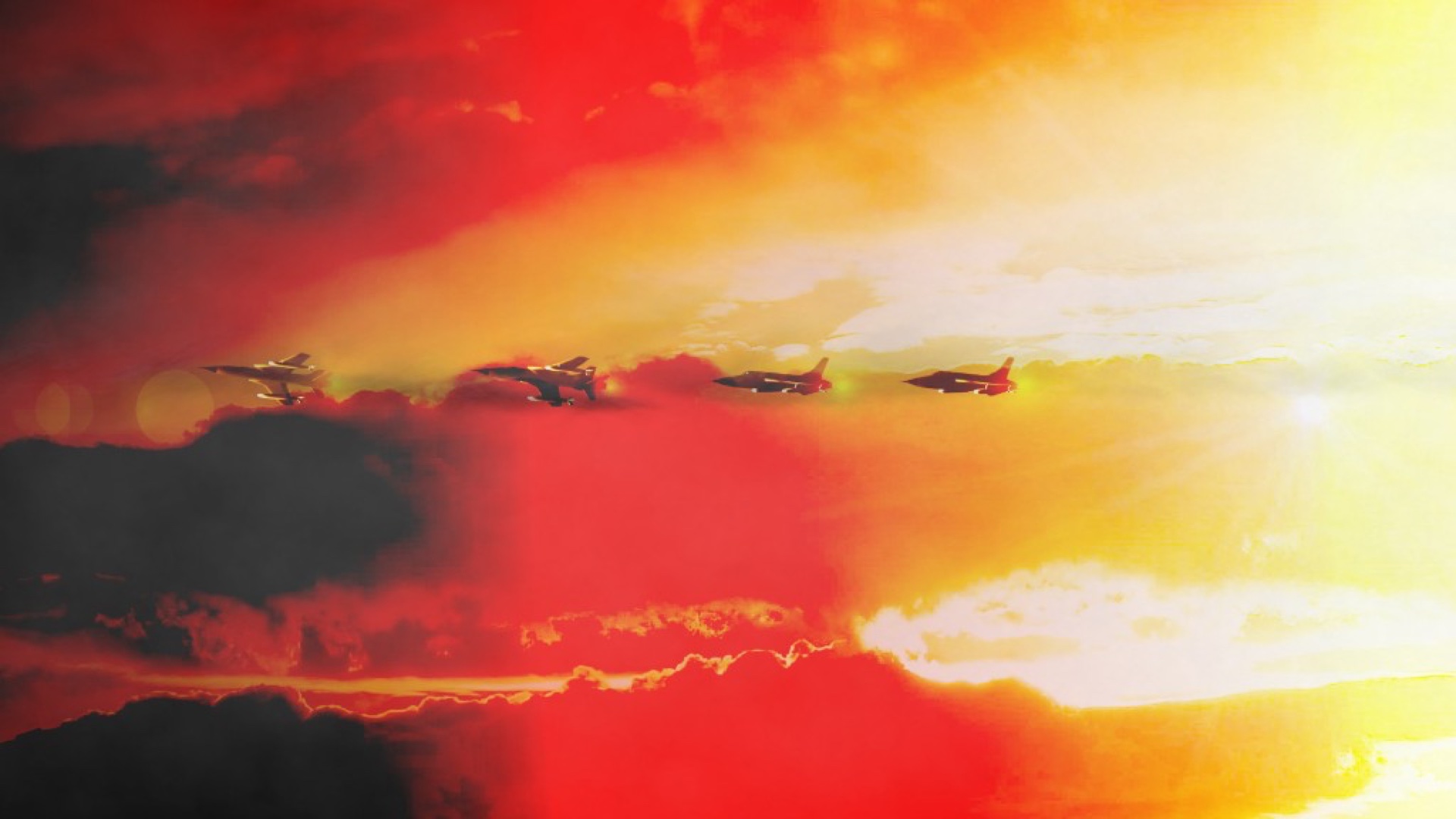 Fighter jets against a sunset sky